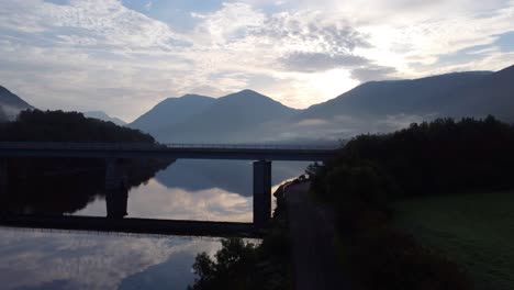 sunrise over a scottish loch with bridge