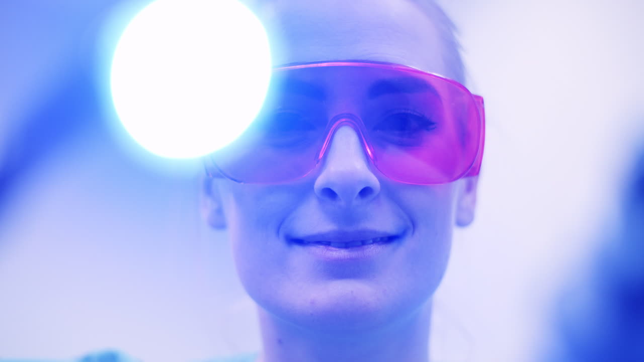 Dentist Using Uv Hardener During Surgey At Healthcare Clinic 4