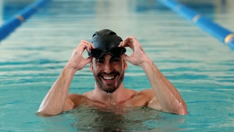 fit man in the swimming pool