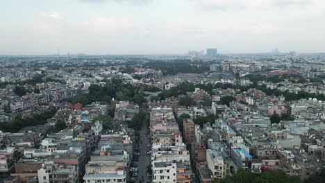 4k aerial shots of new delhi residential suburbs on a beautiful day gliding over rooftops, streets, parks and markets in india