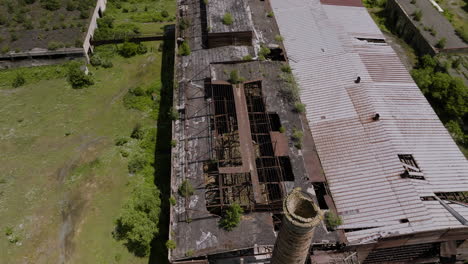 crumbling roofs of an abandoned industrial factory near khashuri town in georgia