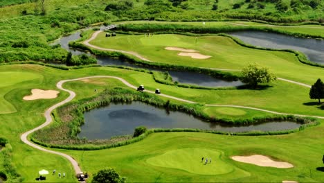 aerial view of golfers and golf carts at northview golf and country club in surrey, british columbia, canada