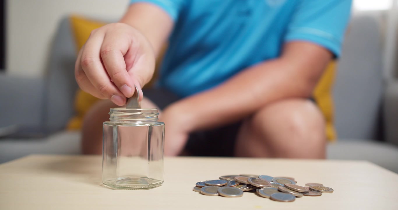 Success strategy for the retirement fund. Personal planning financial for wealth. Putting coins into a jar of saving money for investment.