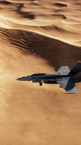 military jet flying over sand dunes