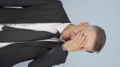 vertical video of businessman gets bad news and gets upset.