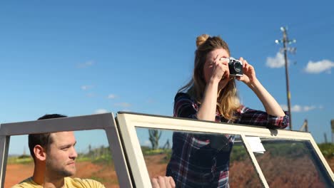 woman taking photo with a vintage camera 4k