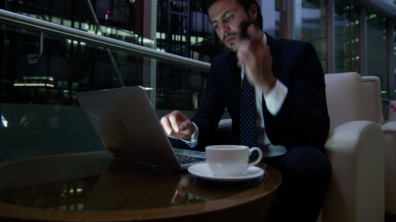 Arabic businessman night office technology laptop smart phone