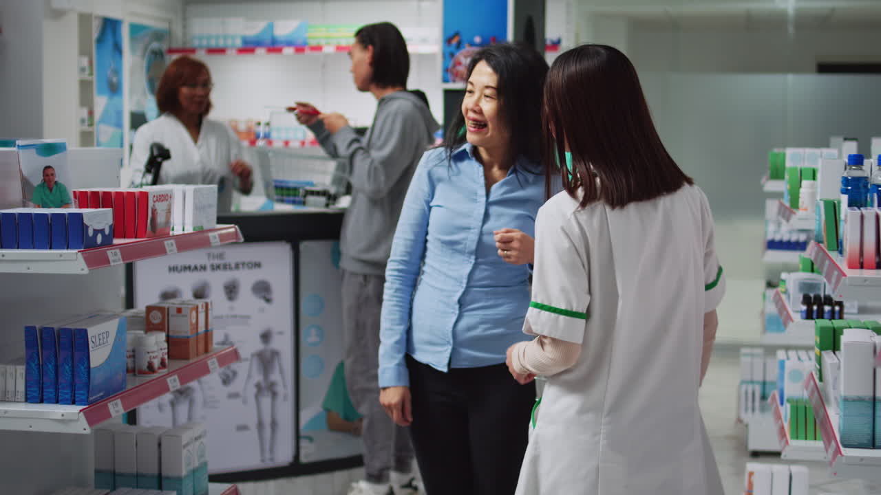 Customers buying drugs at a pharmacy