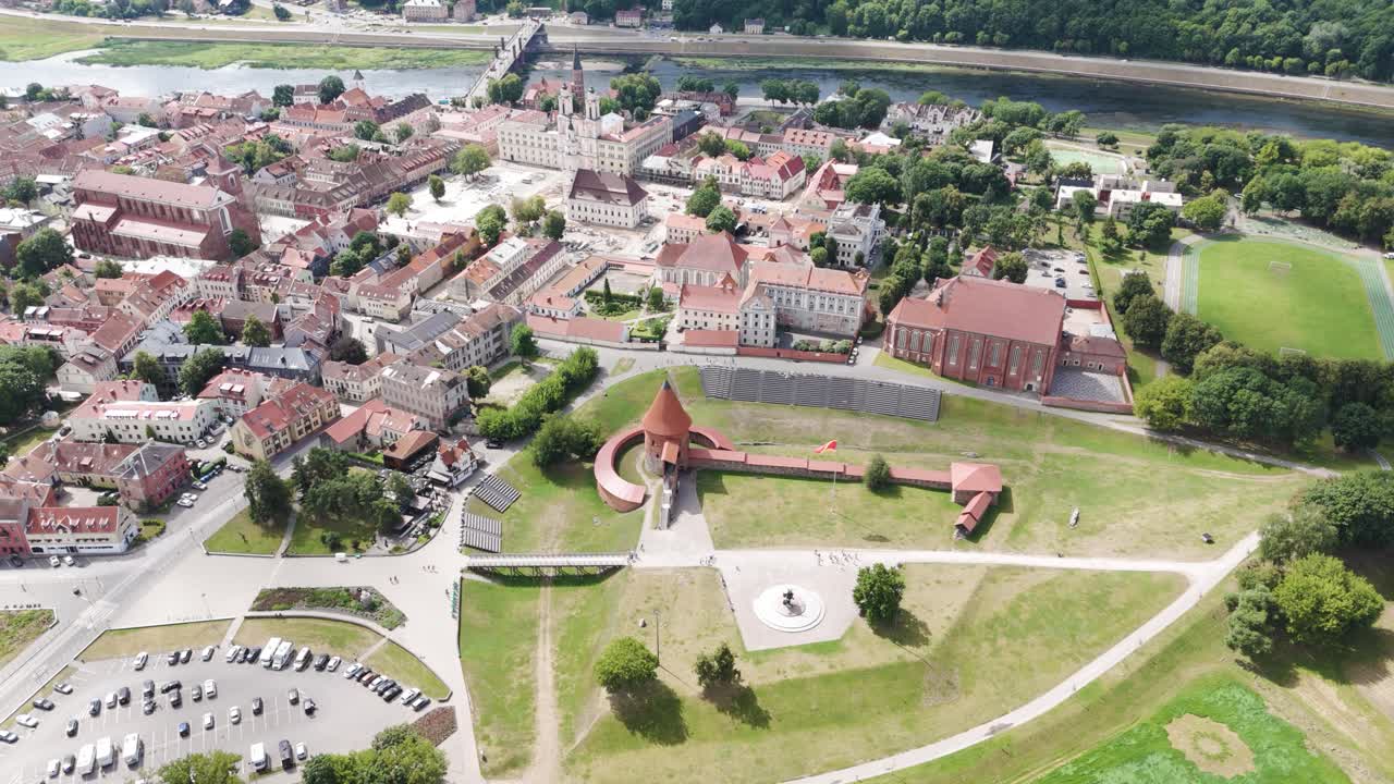 Kaunas city castle and red rooftops of old town, aerial drone view
