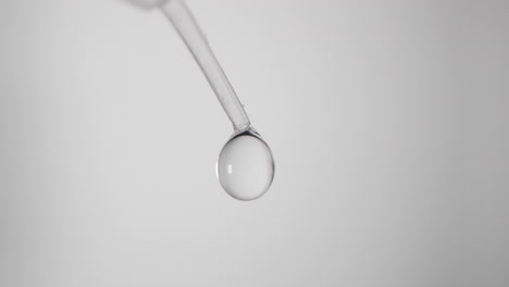 fluid drops from tip of laboratory pipette for covid-19 testing