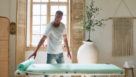 masseur preparing the room for the next client