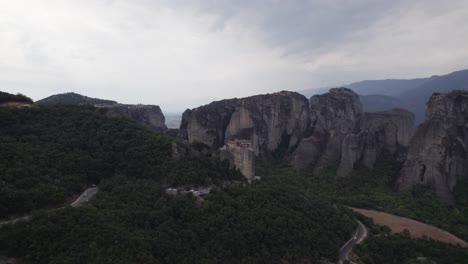 monastery of rousanou in landscape with distinctive geological features