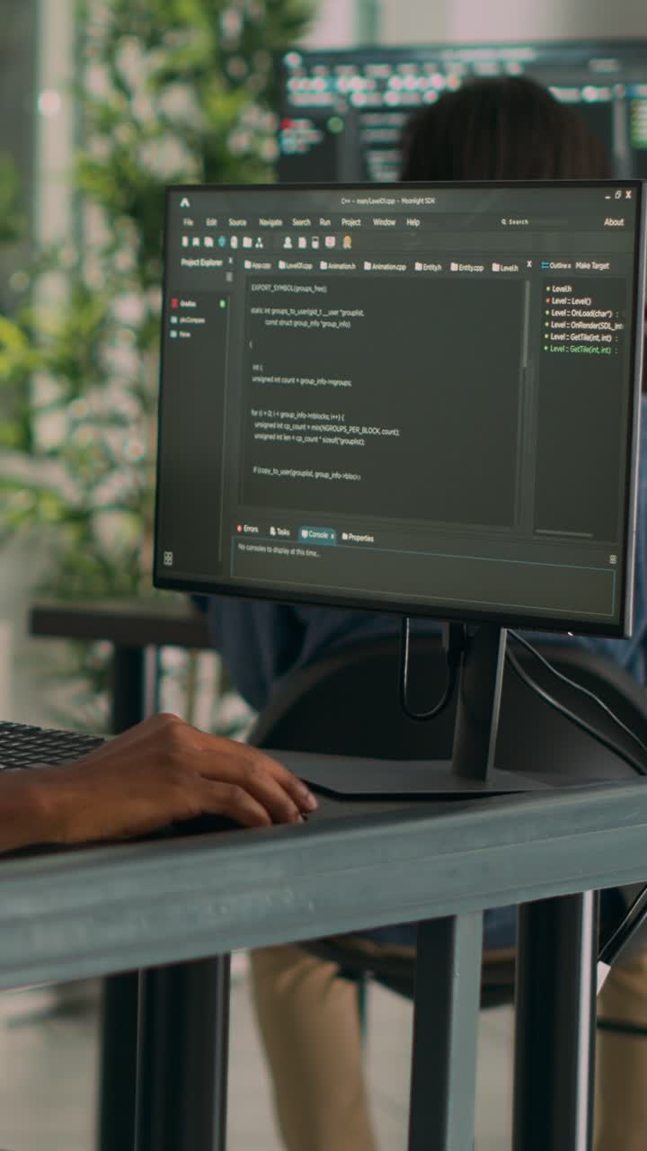 Vertical video: African american coder developing app interface with html code and script