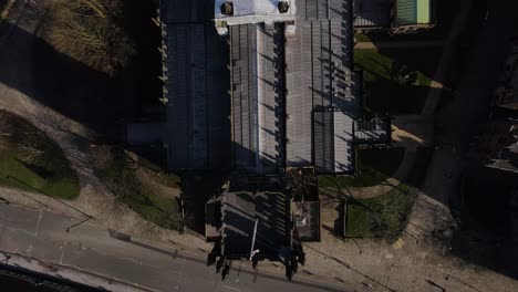 Aerial-drone-flight-over-Manchetsr-Cathedral-rooftop-in-Manchester-City-Centre