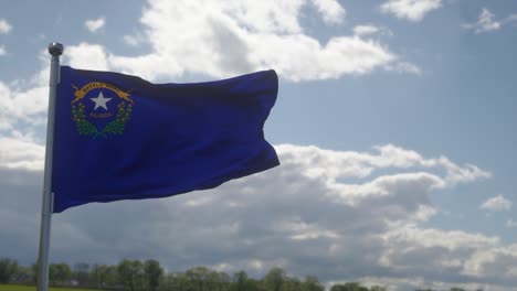 flag of nevada state, region of the united states, waving at wind