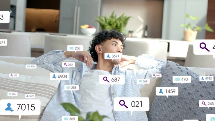 Vertical video: Reacting man in striped shirt lounging at home turning head as UI badges multiply