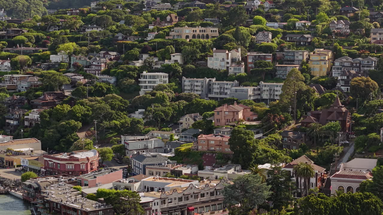 Sausalito, California USA. Drone Shot of Upscale Hillside Homes on Sunny Day, Buildings and Coastal Traffic