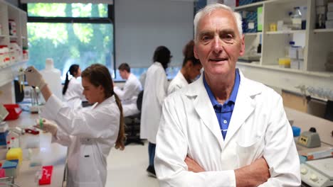 Science-professor-smiling-at-camera-in-class