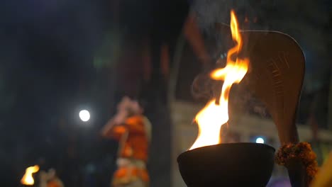 flames in a decorated ceremonial bowl