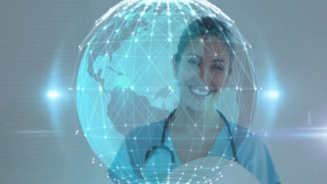 female healthcare worker smiling behind holographic globe, showing health technology network data