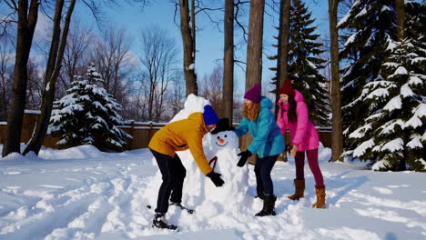 kids building a snowman