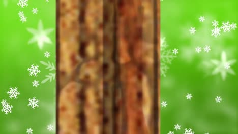 Animation-of-christmas-presents-and-snow-falling-seen-through-window-on-green-background