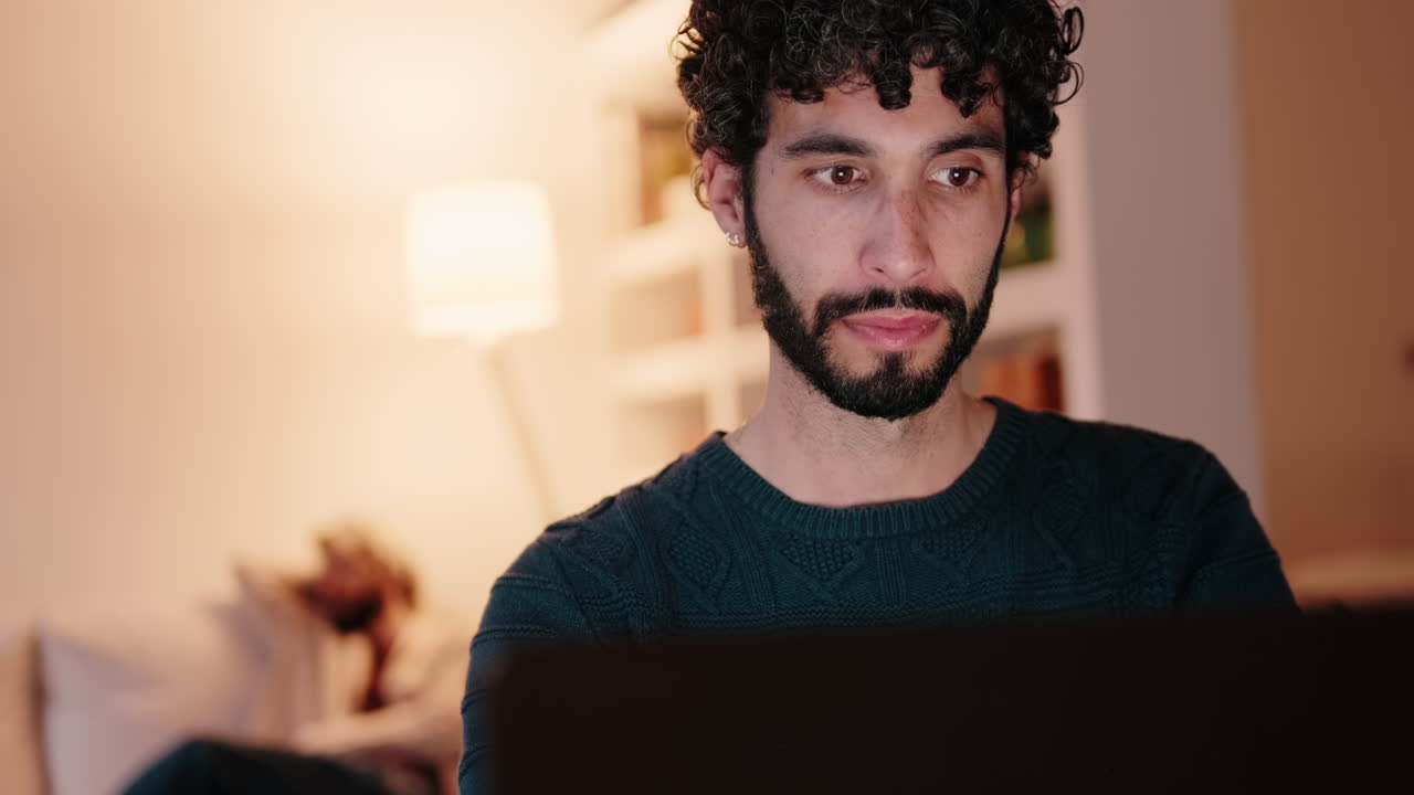 Gay Couple at Home Working on Laptop