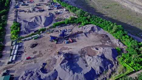 opencast granite mining quarry with working machinery