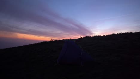 time lapse of remote wild camping tent at sunrise in northern spain