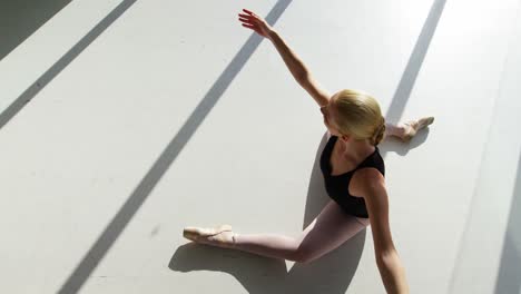 Ballerina-performing-stretching-exercise