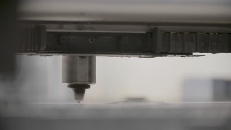 close-up of a cnc machine in operation with sparks, precise metalworking process, industrial background