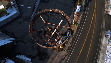 Old-Wooden-Tower-by-Road-in-Crystal-Bay,-Nevada-California-State-Border-by-Tahoe-Lake,-Birdseye-Aerial-View