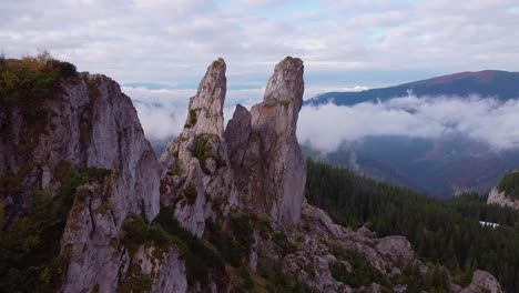 Aerial-shot-of-drone-crossing-between-rock-mountains