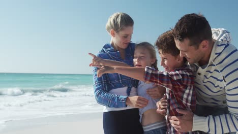 family enjoying free time on the beach together