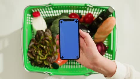 shopping basket with smartphone