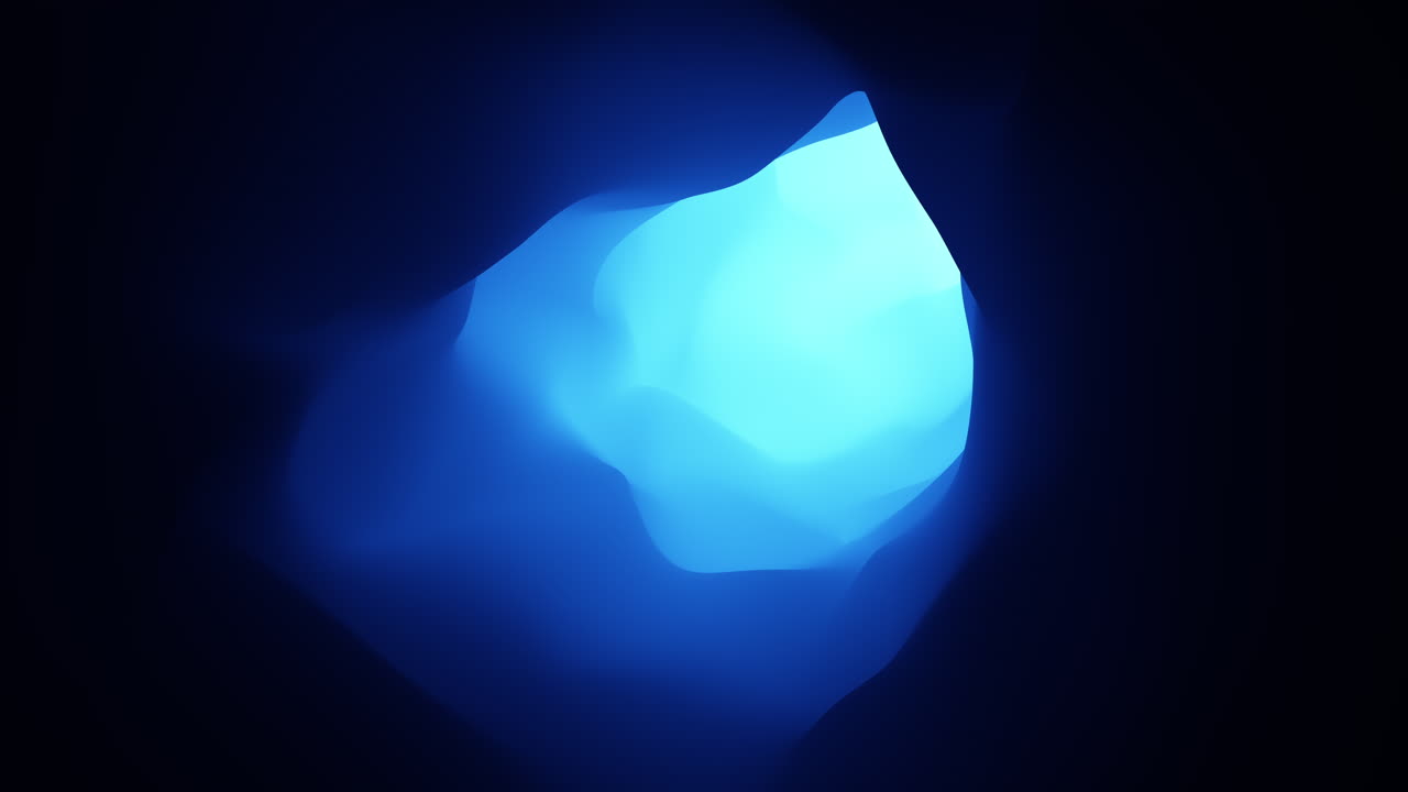 Radiant blue light illuminates enchanting cave