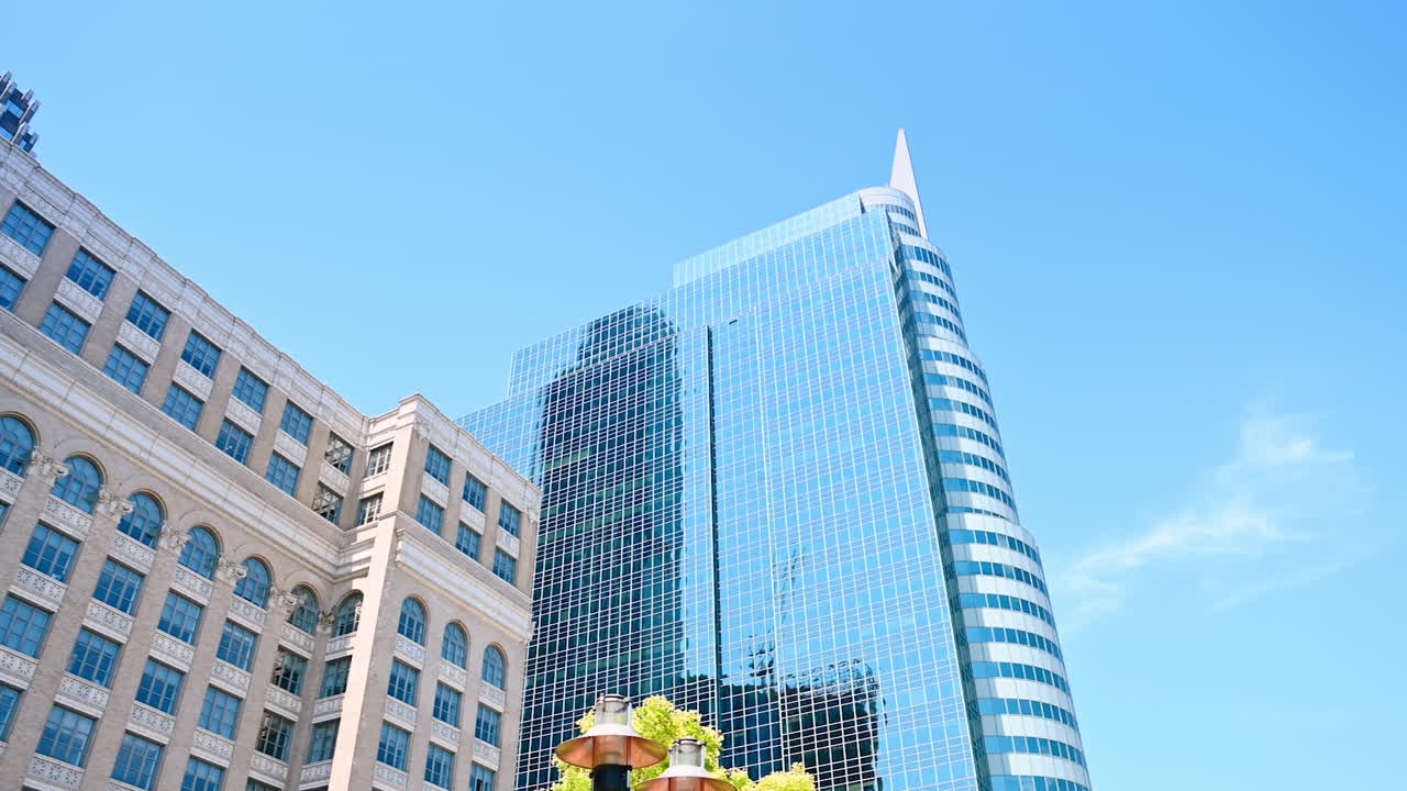 Midtown of modern Jersey with beautiful high-rise buildings. Low angle view on the glass-façade of the skyscraper