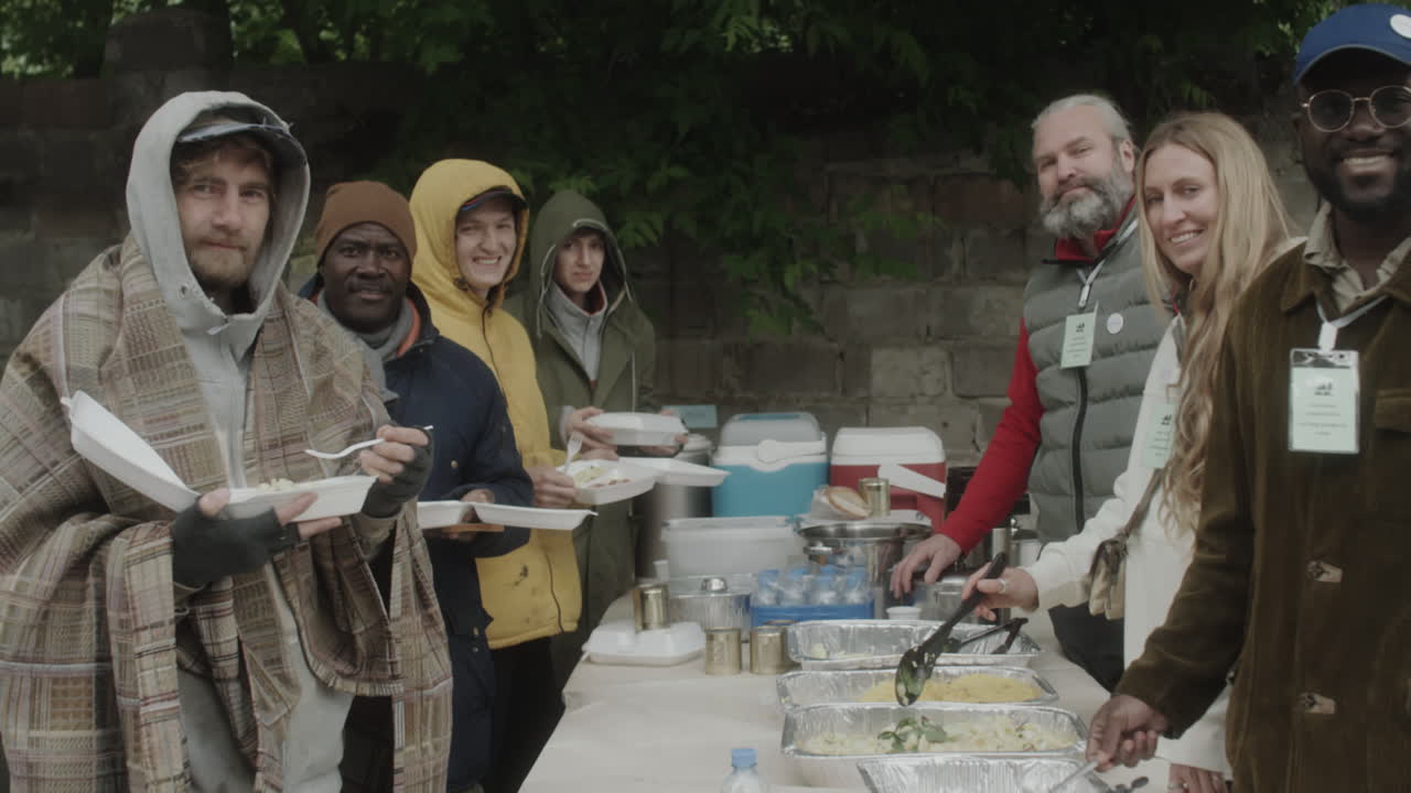 Volunteers Serving Meals at an Outdoor Community Food Distribution Event