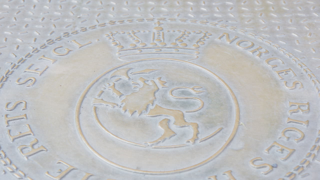 Coat of arms symbol in front of Oslo Supreme Court building in Norway, pan shot