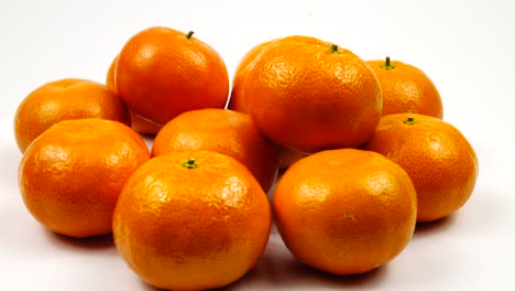 fresh tangerines against a white background