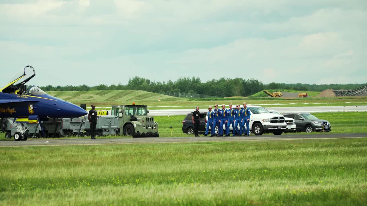The Blue Angels squadron performing a synchronized and choreographed routine at an airshow