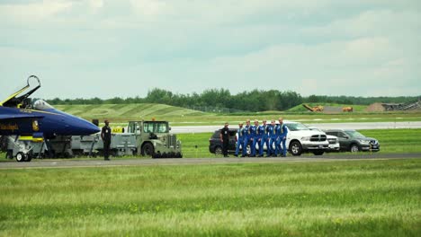 the blue angels squadron performing a synchronized and choreographed routine at an airshow
