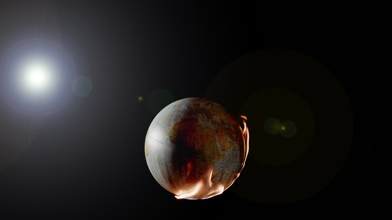 Flames consume globe of mother earth creating scorched earth, backlit lens flare