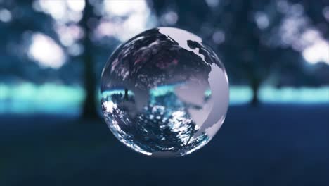 crystal earth globe in forest