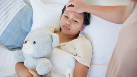 mother, bed and sick child with thermometer