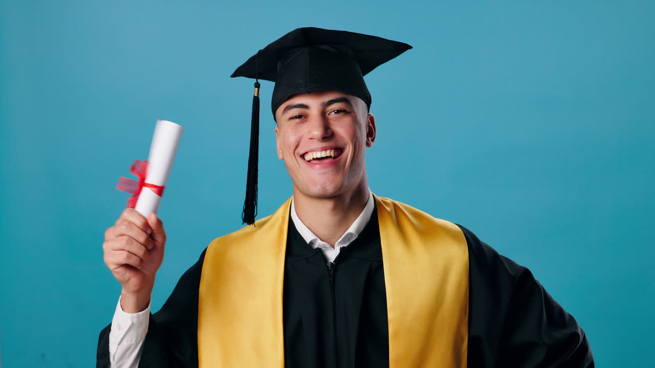 A graduate celebrating his graduation with a diploma