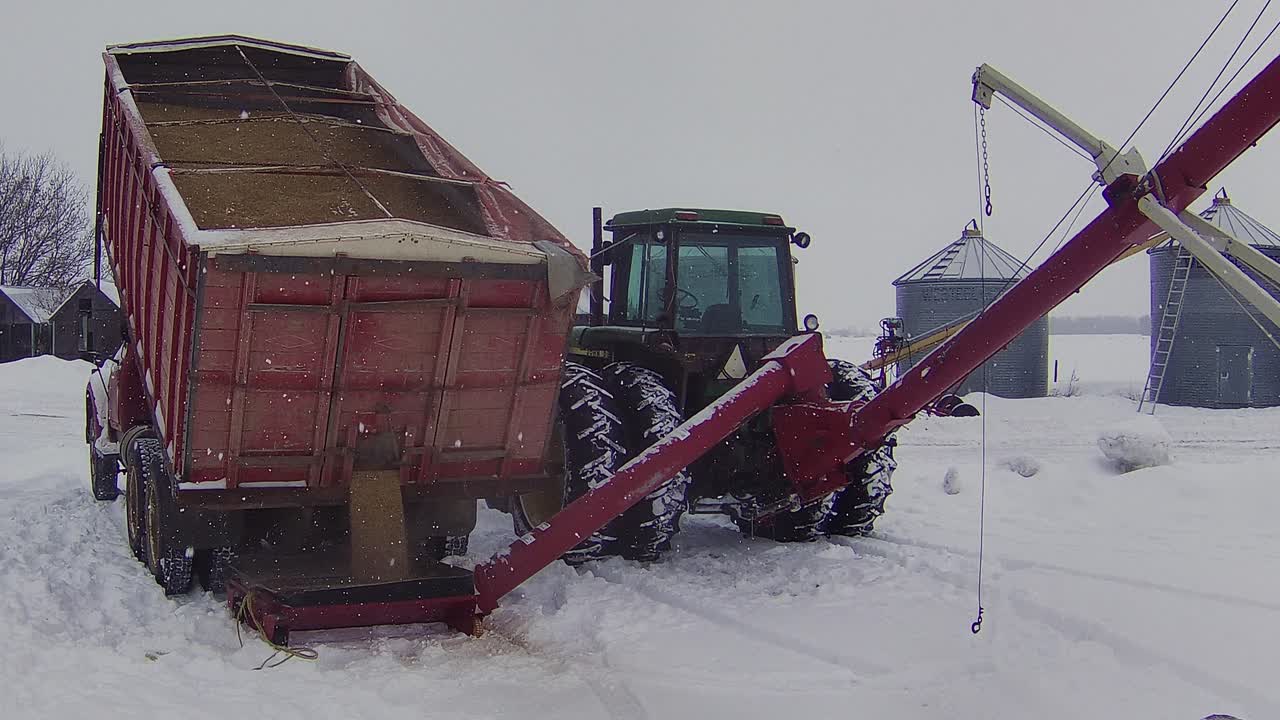 Grain transfer on a snow-covered farm