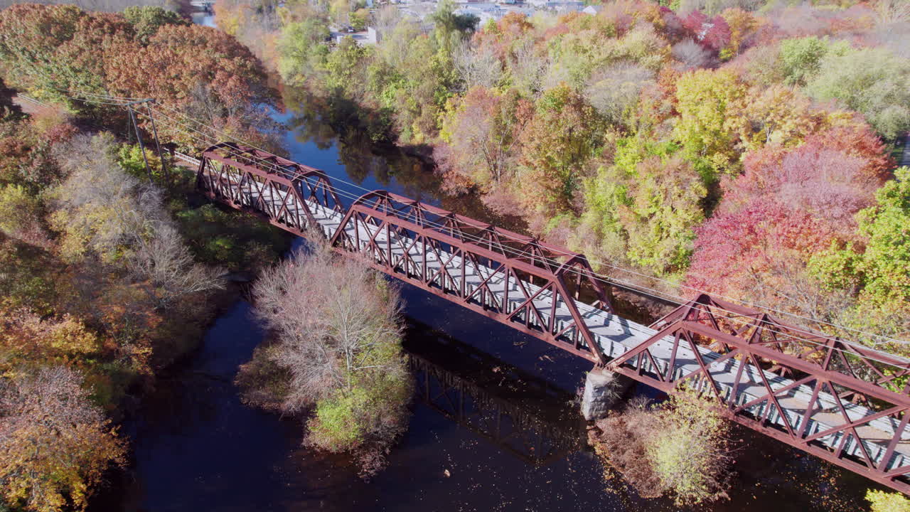 Descending aerial view of the Pawtuxet River Trail Truss Bridge, West Warwick
