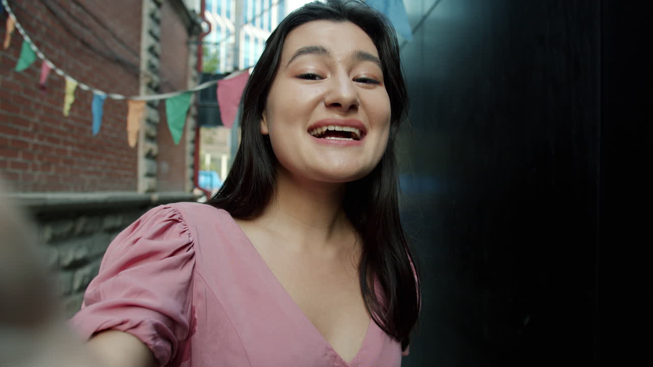 Woman Taking Selfie in Urban Alleyway