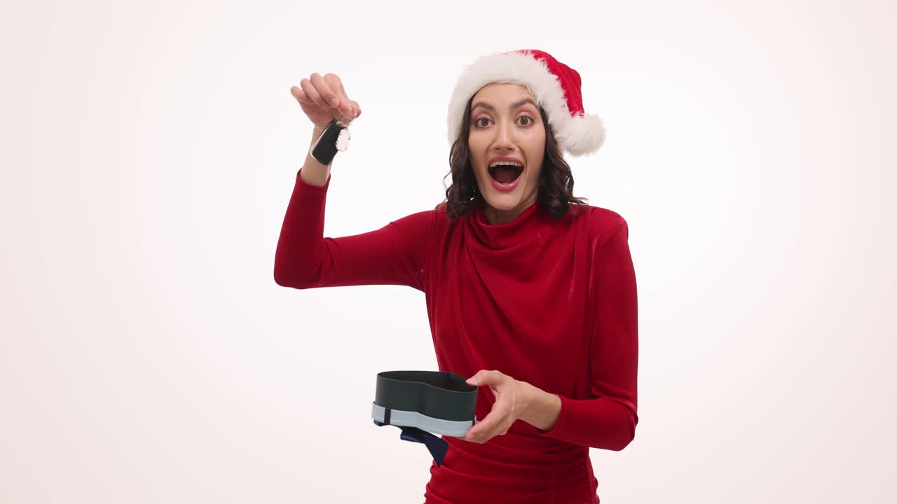 Woman in Santa Hat Receives Car Keys as Christmas Gift